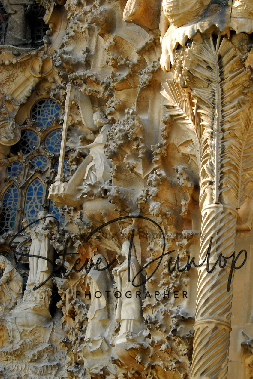 Barcelona Spain-6965 
 South Europe. Iberia. Spain. Catalan. Barcelona. A motif on a wall of The Sagrada Familia, Antoni Gaud's unfinished masterpiece in the city of Barcelona 
 Keywords: Spanish City Buildings Town urban Cafe society